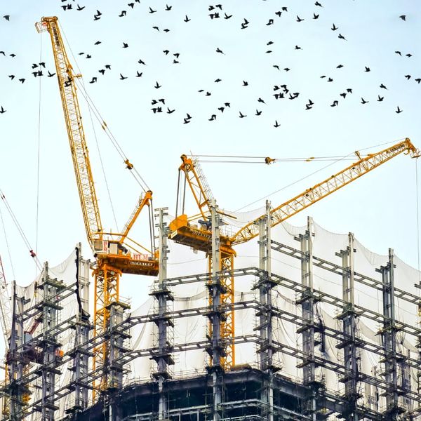 Building under construction and cranes - Photo by Danist on Unsplash